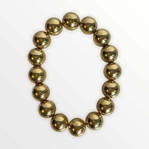 Plastic large beaded gold toned bracelet